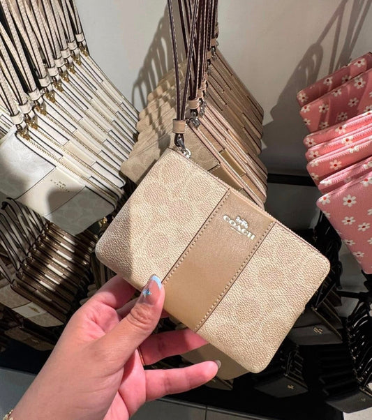 Coach Corner Zip Wristlet In Signature Canvas With Stripe - Beige