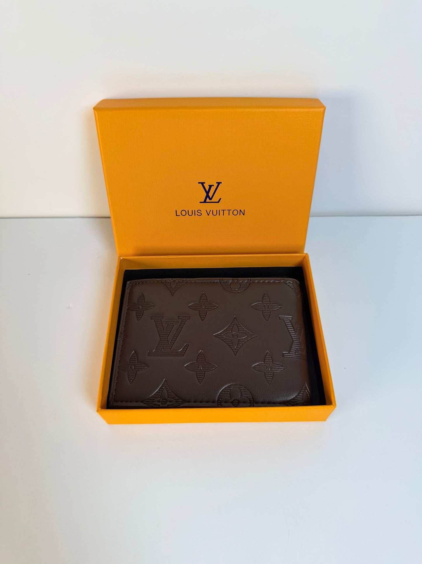Louis Vuitton Engraved Monogram Embossed Leather Wallet- Brown