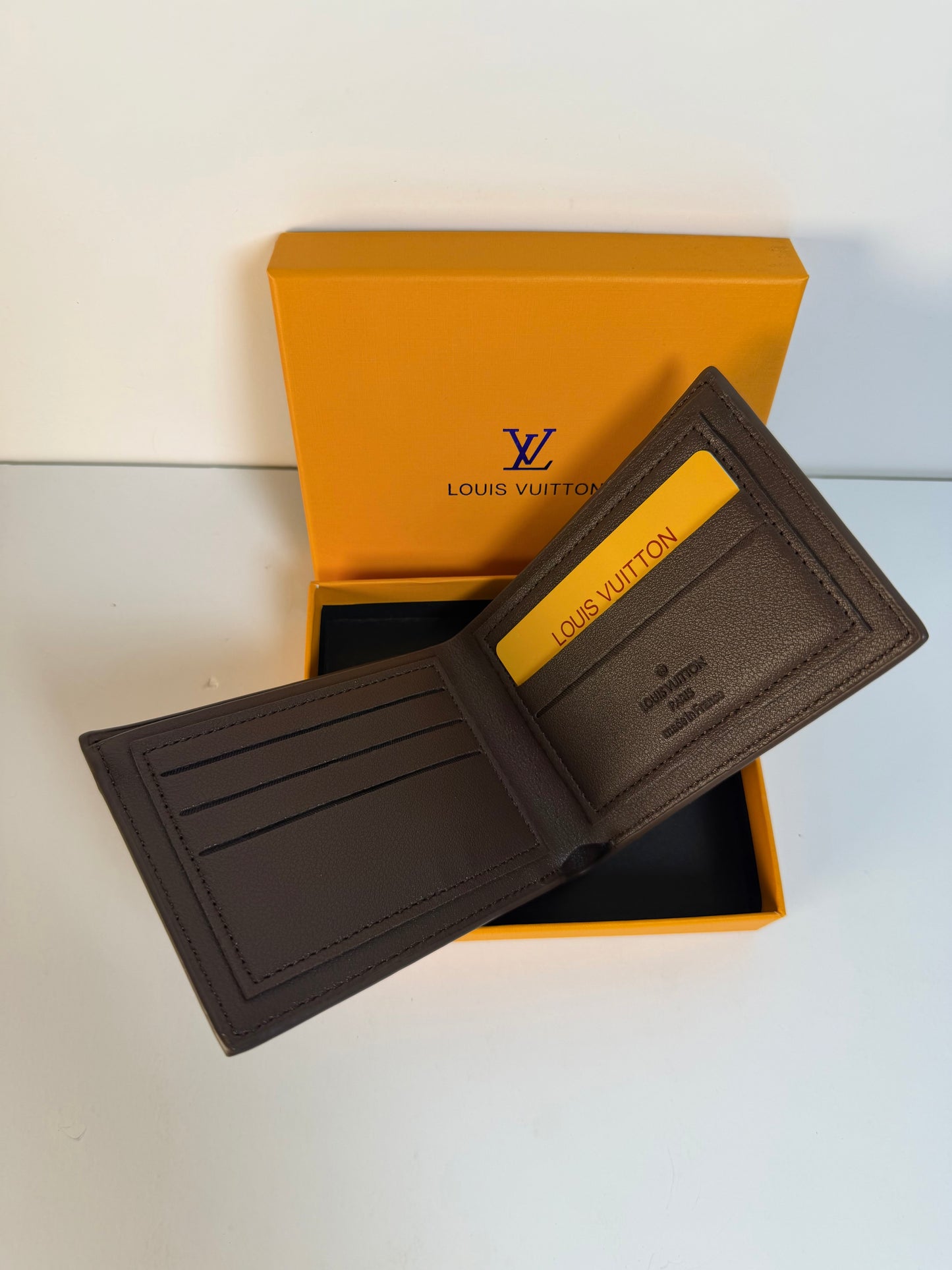 Louis Vuitton Engraved Monogram Embossed Leather Wallet- Brown