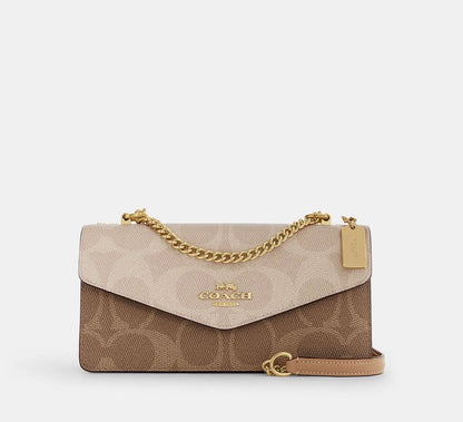 Coa*h Klare Envelope Crossbody Bag in Signature Canvas